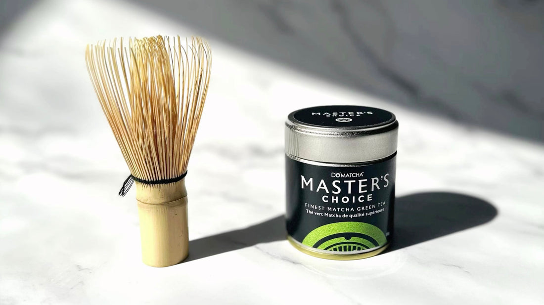 A close up of Master’s Choice premium matcha container and whisk.